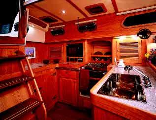 Her galley is open and spacious A full seven cubic feet of refrigerator space is accessible through two top lids and a front door.