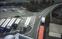 achieved through the use of additional lane markings leading