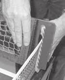 The tension of the Trap Net is adjusted by tightening or loosening the velcro straps at the sides of the Trap Net (see Figure 16).