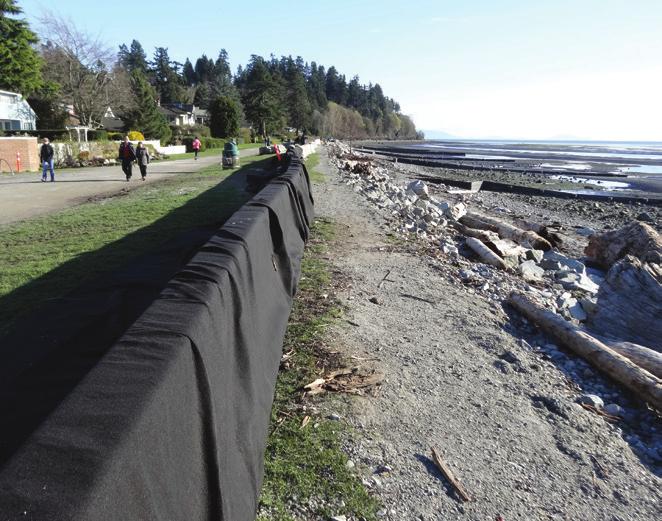 7 Temporary concrete barriers put up after March 10th, 2016 storm damage. Storm surge in January 2010 during a king tide event, which resulted in the tides overtopping the dyke.