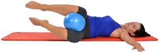 Lay on your back, placing the Mambo Max Soft-Over- Ball under your bottom. Keep your knees at hip-width.