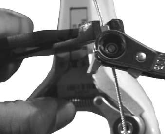 To move the brake side-to-side, loosen the bracket attachment bolts, reposition the brake, and re-tighten the bolts. Figure 5. Holding the wedge while tightening the cable clamp nut Table 5.