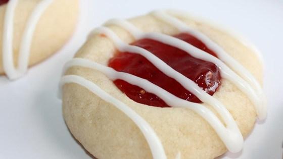 Raspberry and Almond Shortbread Thumbprints Ingredients: 1 cup butter, softened 2/3 cup white sugar 1/2 teaspoon almond extract 2 cups all-purpose flour 1/2 cup seedless raspberry jam 1/2 cup