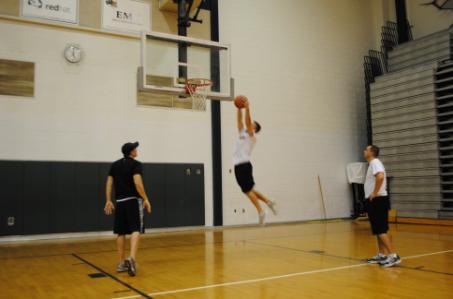 First player in line jumps up and tries to grab the ball at the highest point possible. 3).