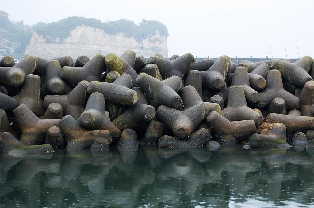 Tetrapods Four legged concrete structure used as armour unit on breakwaters.
