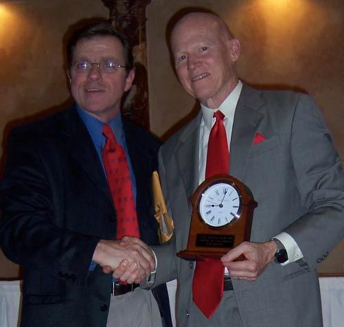 Picture #3: Dick Buerkle being congratulated by Michael Reif, Presentation and Award