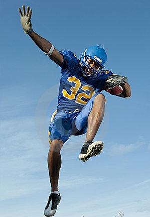 After scoring a touchdown, a 84 kg wide receiver celebrates by leaping 1.