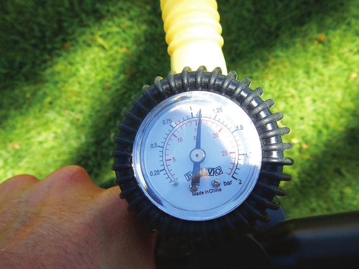 Ensure that there is no water or debris in the valve and then take the other side of the air hose and attach to the valve on the board by twisting in a clockwise direction until snug.