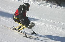 skier uses outriggers with the mono ski for balance Mono ski videos: http://www.youtube.