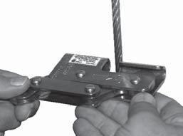 The arrow on the 128 Cable Fall Arrester must be pointed upward. Release the cam handle to close cam against the cable.