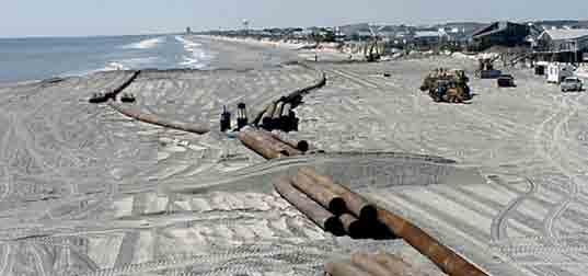 Photo courtesy of Marlowe & Company BEACH NOURISHMENT PROJECTS ARE ENGINEERED Coastal engineers use their knowledge of complex coastal processes and decades of experience in beach nourishment to plan