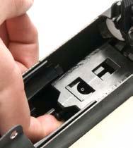 As shown in Figure E-8, ensure the forward part of the grip assembly is inserted under the grip catch and rotate the grip down.