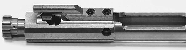 MAINTENANCE Bolt Disassembly 1. Using a 1/16 punch, push in the firing pin retaining pin right to left and pull it completely out. 18 2. Tilt the bolt face up and remove the firing pin.