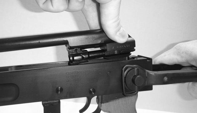 6. Remove the bolt carrier and bolt from the rifle by holding the receiver with one hand and the cocking handle with your other hand. Pull the bolt carrier and bolt to the rear as far as possible.
