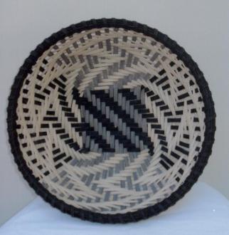 Woven on a class mold in a chase weave with natural and black cane. Staves will be pre-inserted prior to the class.
