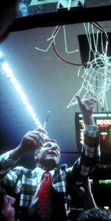 Norm Sloan cut down the net after leading North