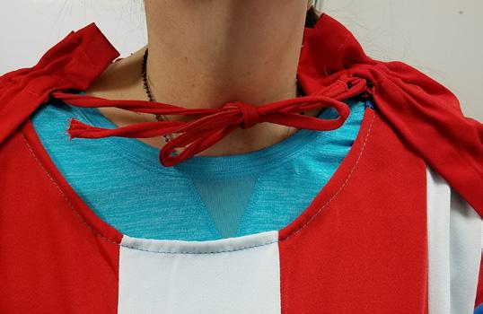 Be sure belt is not too tight causing costume to pucker. Step 3 Step Into the Jumpsuit & Attach Cape 1.