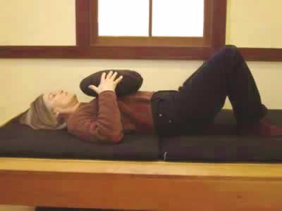 LYING DOWN POSTURES This posture involves lying on your back with knees bent, providing stability and alignment of the spine.