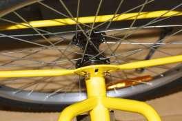 Fit the rear brake cable as shown in the photograph, again it is necessary to partially squeeze the brake arm and then tightened the