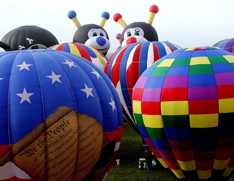 Punch Here Joey Little Bee, l, and Lilly Little Bee peek up from other balloons at the 35th annual QuickChek New Jersey Festival of Ballooning at Solberg Airport in Readington, NJ, the