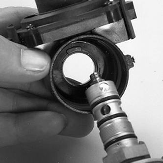 Note: Make certain that the bypass sleeve O-ring remains in its groove on the end of the bypass sleeve during reassembly. 6. Place a 1 open-end wrench on the hex flats of the valve and lever assembly.