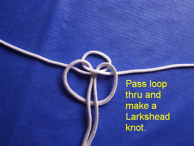 Insert the tow point and make a larkshead Now, insert your tow loop or main bridle line through the loop you created and make a typical Larkshead knot. Pretty simple so far eh! ;) Last but not least.