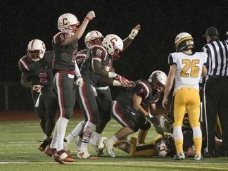 The Canton Chiefs are fired up after forcing a Saline turnover during the Oct. 27 Division 1 pre-district contest.
