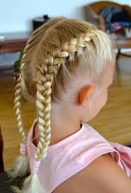 HAIR Two french plaits with centre parting. Bobbles on the end and white bow ribbons or bobbles.
