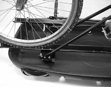 When using: (1) Bike Rack Locate Wheel Trough to vehicle side of Cargo Tray.