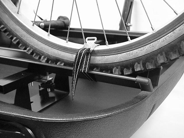 GENERAL OPERATING INSTRUCTIONS continued Place straps on each wheel of the bike and around wheel trough as shown. Tighten strap until wheel is held firmly.