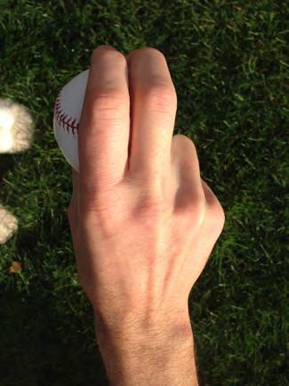 Curveball/Knuckle Curveball The grip I used. Pressure with the middle finger on the inside of the seam. Notice where middle finger is on the seam.