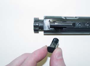 5. Insert the cam pin (You don t need to rotate it as you would in an M16.) 6. Drop the firing pin into its opening.