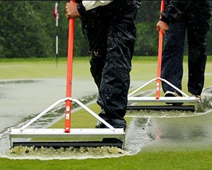 For shallow puddles, use a roller squeegee. Only use roller squeegees made for turf.
