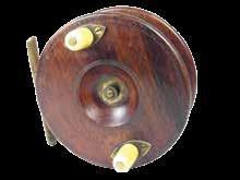 258 A rare Hardy Ocean (1894-96 model) Scarboro style 4¾ walnut sea centre pin reel, solid drum with twin domed ivorine handles, spindle recess with moiled brass tension screw, brass stancheon foot,