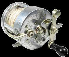 with a central position for free spool mode, rear optional check lever, milled nickel silver spindle caps, backplate with two applied alloy plaques stamped model and make details, reel is in good