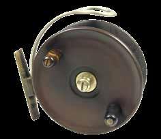 553 A rare Hardy Megstone (1904-1916) ebonite 4¾ sea centre pin reel, solid drum with twin cow horn handles and central milled nickel silver tension nut with domed locking screw, brass