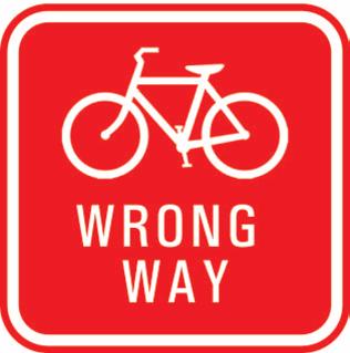 On one way bicycle trails, WRONG WAY signs shall be installed on the back of bicycle guide signs to reinforce that the