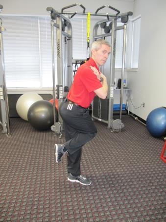 5b. Pelvic Rotation Advanced Stand on one leg, with the foot off the ground tucked behind your other knee, like a stork.