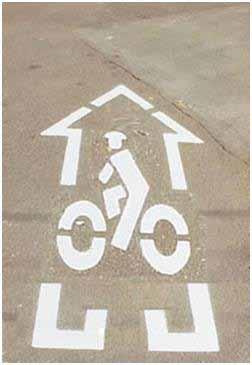 EVOLUTION OF SHARED LANE MARKING DESIGNS The original bike-in-house design that has been used or slightly modified in other locations for some time is shown in figure.