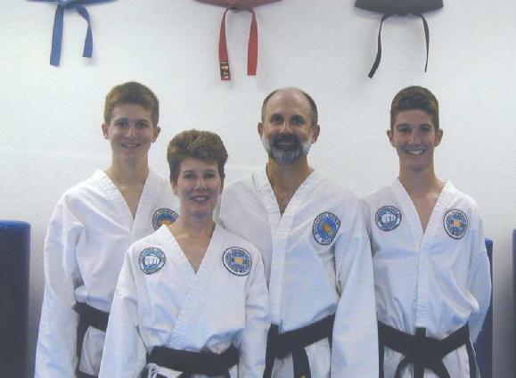 The Curzons at Tom s second degree black belt testing in August of 2003.