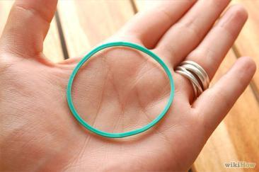 How to Make a Rubber Band Appear to Switch Fingers One Hand Hopping Rubber