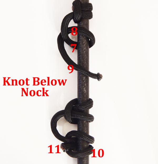 Repeat the same knot, but starting the opposite way. The final knots should end up opposite of each other with the top melted end facing away from the archer and the bottom towards.