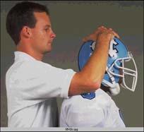 participating in game Football Helmet Fitting Push down on the helmet;