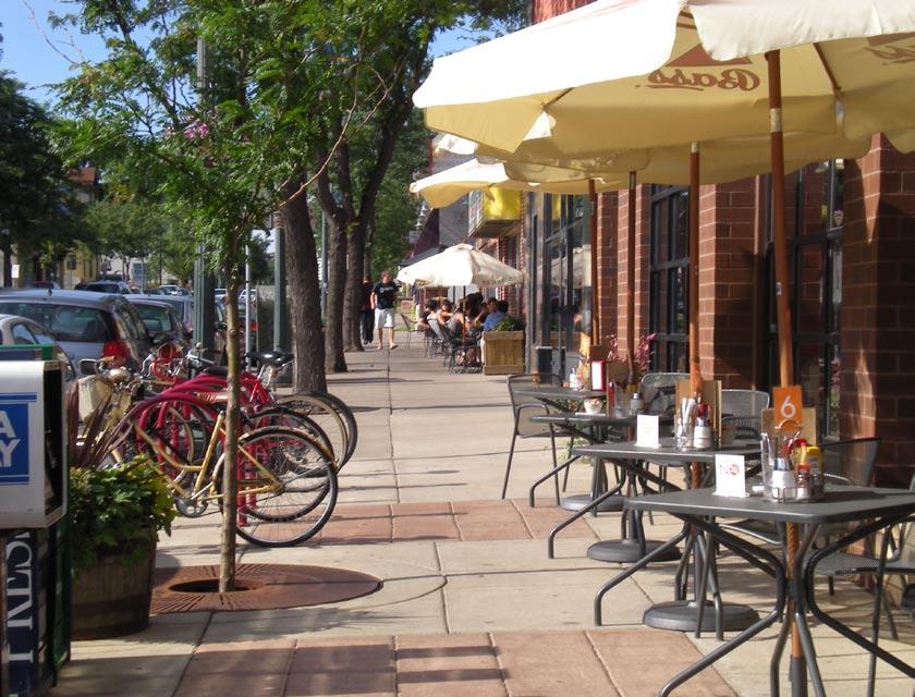 Figure 9-19: A pedestrian scale street. Nicollet Avenue has wide sidewalks and trees that create a comfortable environment for walking and sitting at one of the many sidewalk cafes.