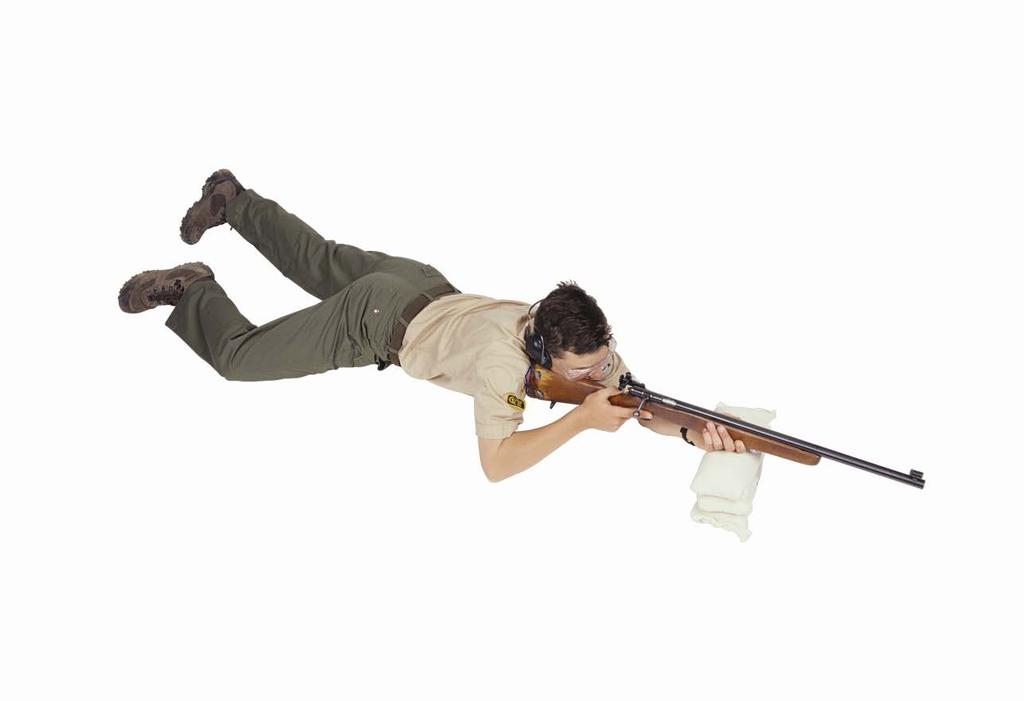 Feet and legs are flat on the ground with the legs relaxed. Prone Supported Position Butt of the rifle in the shoulder close to neck.