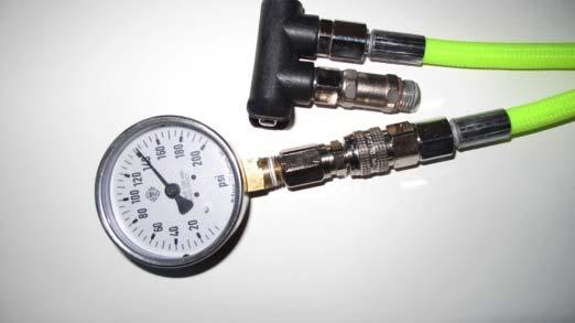 Remove the clamp ring from the oxygen regulator, (A) and lift the black plastic plug, (B) out of the regulator cap. Connect the regulator to an oxygen cylinder which has at least 800 psi remaining.