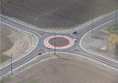 6.1.5 Central Island The central island of a roundabout is the raised, mainly non-traversable area surrounded by the circulatory roadway. It may also include a traversable truck apron.