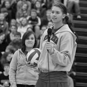 Middle: Lindsey Licht speaks to elementary school kids as