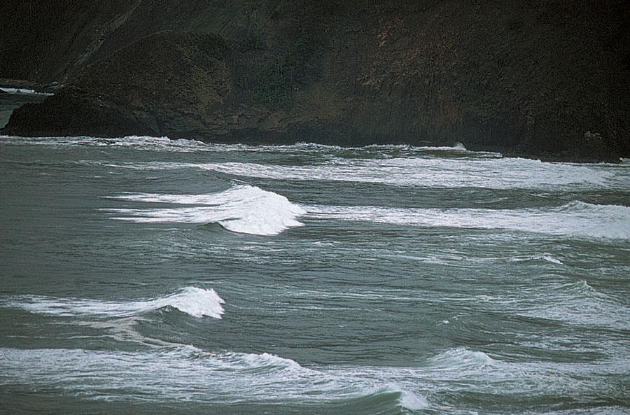 Spilling surf occurs where the slope toward the shoreline (bottom)