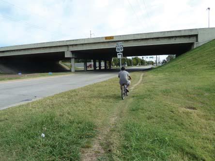 EAST 21ST STREET AT HIGHWAY 169 Lack of sidewalk under the Highway 169 overpass Lack of crossing at the Highway 169 off ramps Lack of
